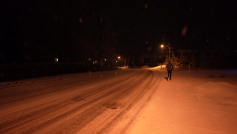 running in quiet street at night in snow