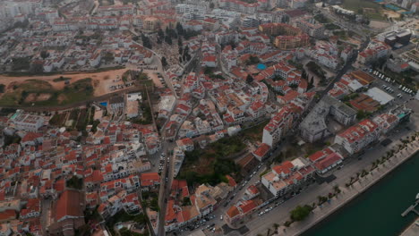 Scenic-aerial-drone-view-of-Lagos-cityscape-buildings,-Algarve,-Portugal,-dolly-in,-day