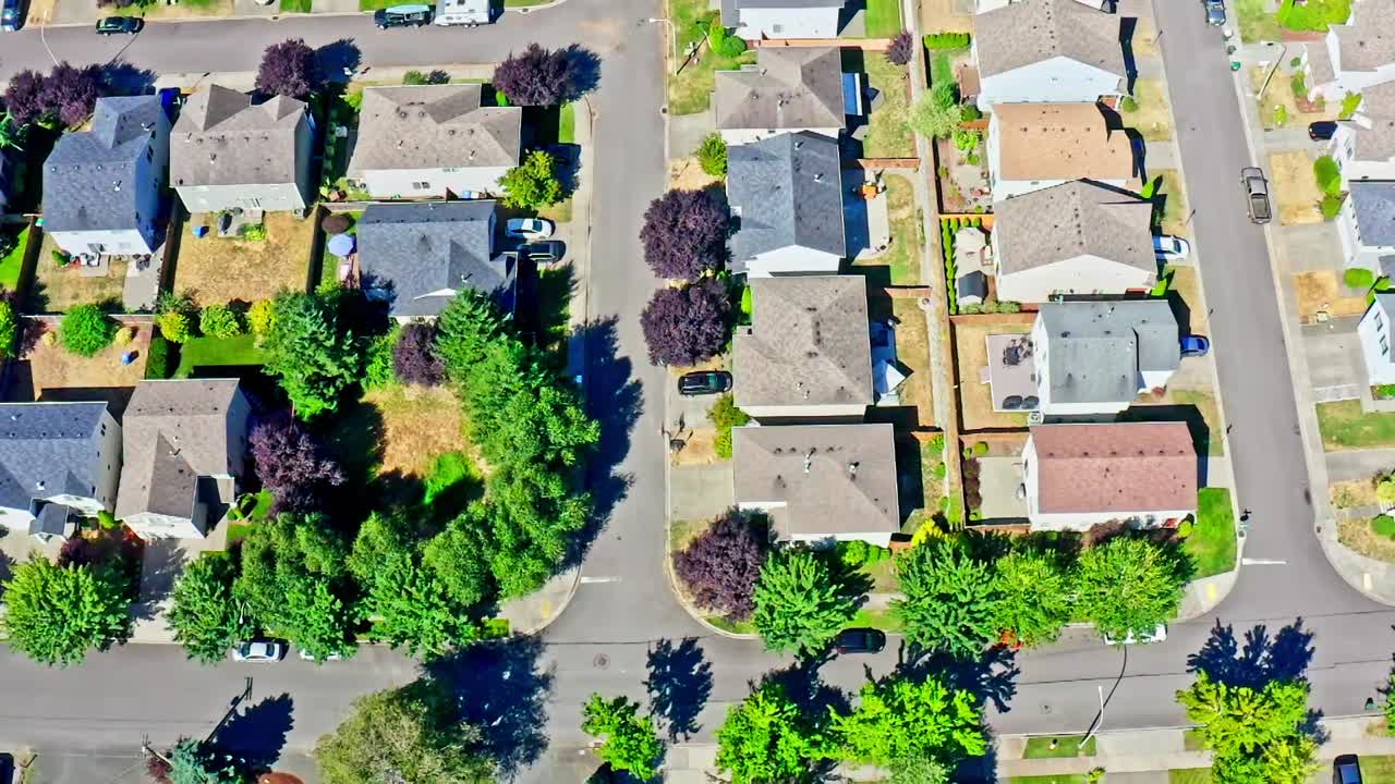 A suburban neighborhood in tumwater, washington, showing houses and streets, aerial view