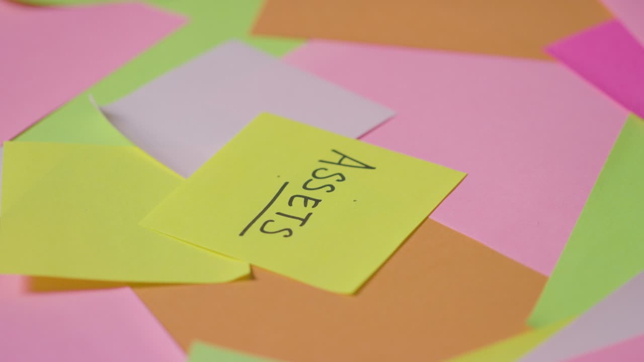 Business Concept Of Revolving Sticky Notes With Assets Written On Top Note 1