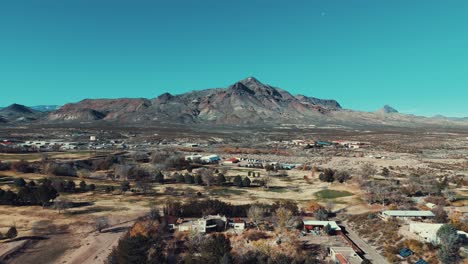 mountain with small town with houses below