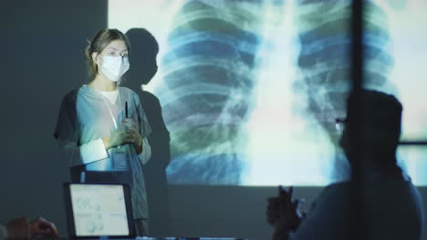 female doctor explaining chest x-ray to colleagues