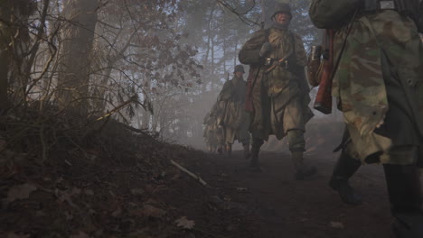 german soldiers in a foggy forest during world war ii