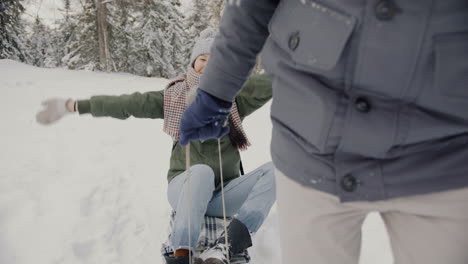 winter fun sledding in the woods
