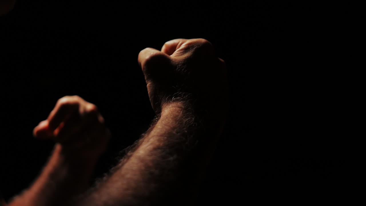 Close-up of Two Hands During a Tense Confrontation