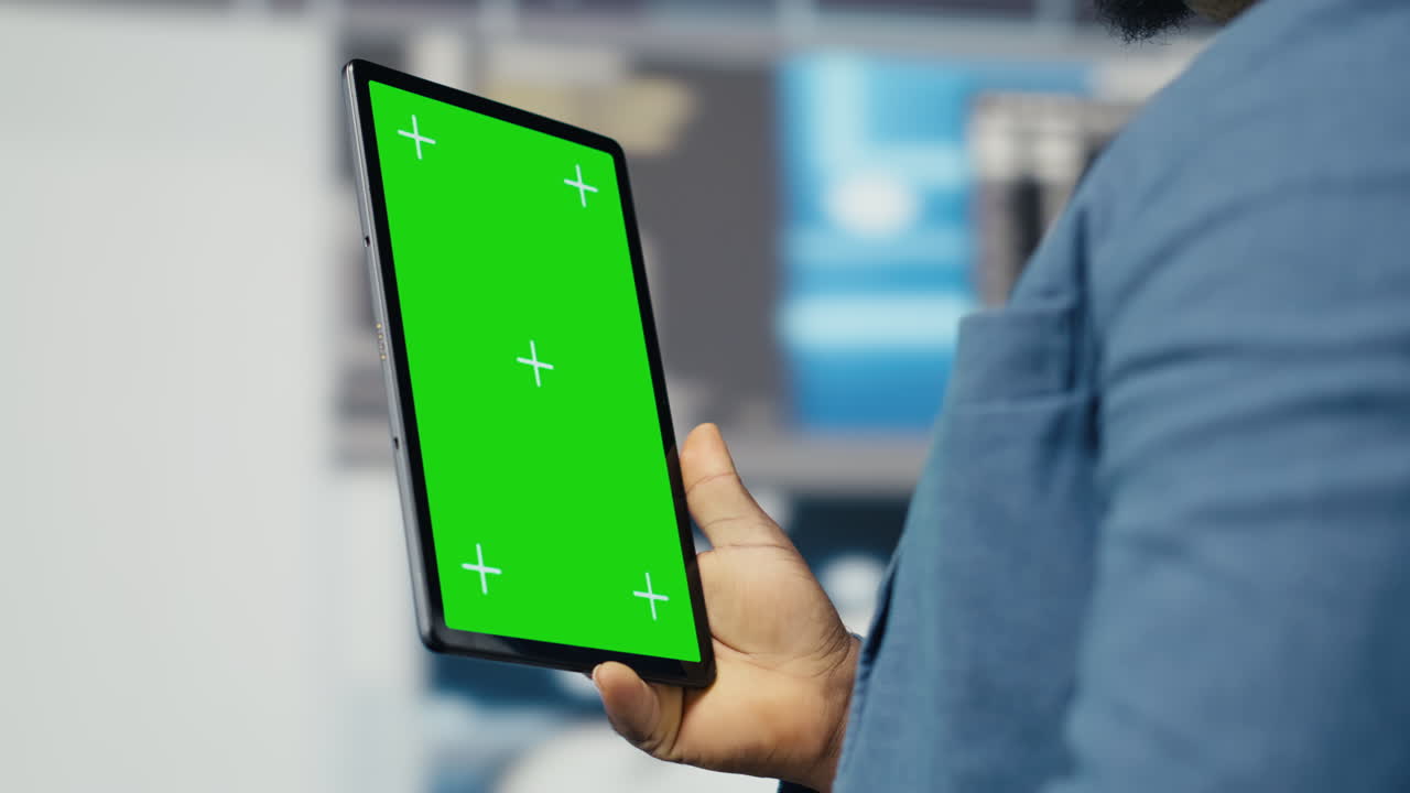 Black tech savvy programmer uses chroma key screen from innovation hub