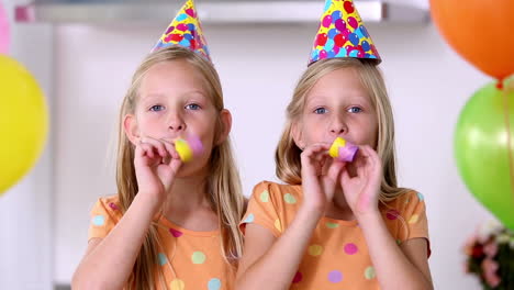 twin sisters at a party