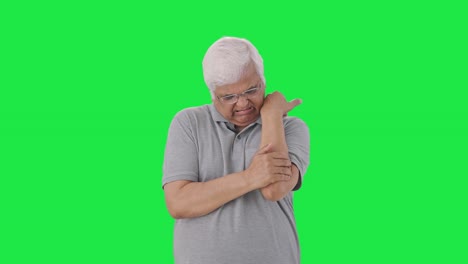 sick indian old man suffering from arthritis green screen