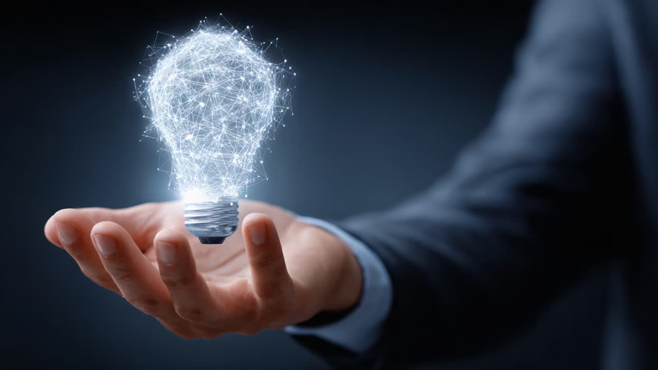 A visionary idea illuminated: A hand holds a sparkling, futuristic light bulb, symbolizing innovation, creativity, and bright new concepts emerging from a dark background