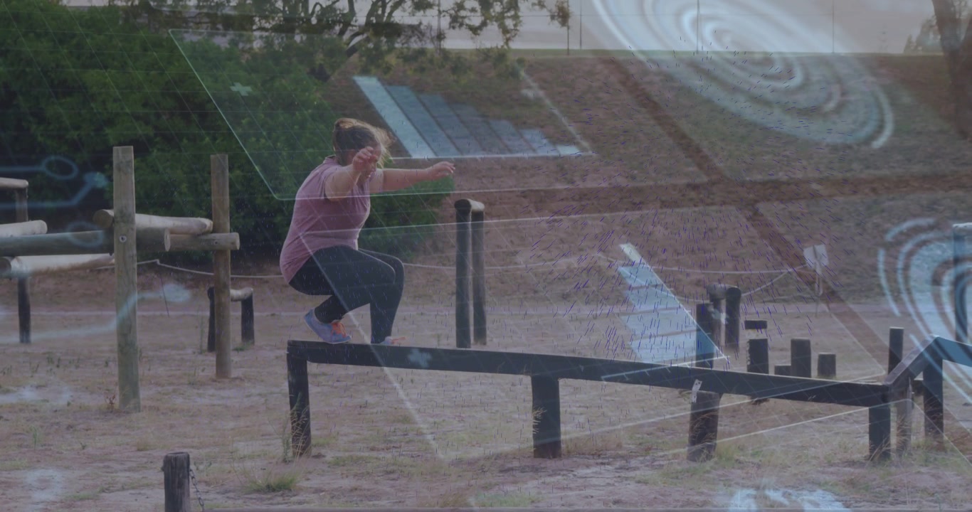 Adult woman stepping onto balance beam, navigating outdoor fitness course, shifting arms balancing