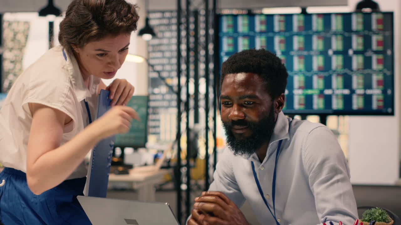 Multinational work team analyzing business intelligence reports and metrics