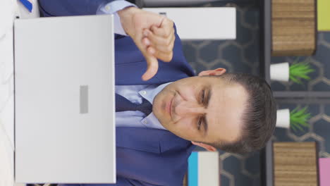 Vertical-video-of-Businessman-working-on-laptop-unhappy-and-negative.