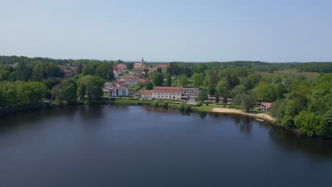 spectacular aerial top view flight vacation paradise village city chlum at lake hejtman in czech summer day 2023