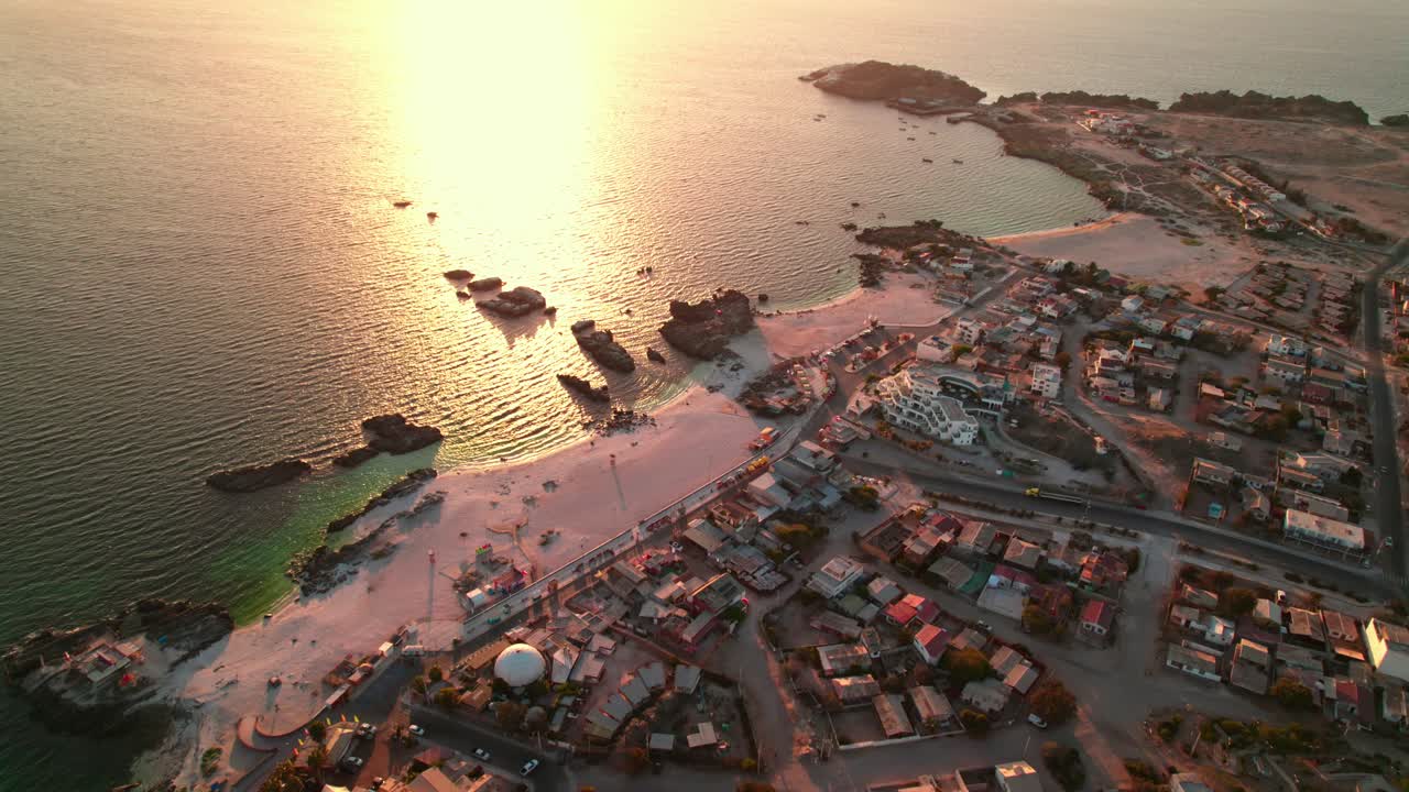 Aerial Panoramic view of Bah&iacute;a Inglesa resort and beach during golden hour