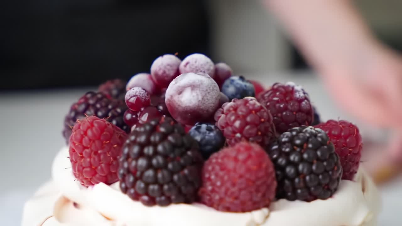 A Delicious Arrangement of Fresh Berries on a Beautifully Crafted Meringue Cake Showcasing Raspberry, Blackberry, and Blueberry Toppings for a Tempting Dessert Delight