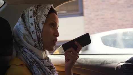 young woman wearing hijab out and about in the city