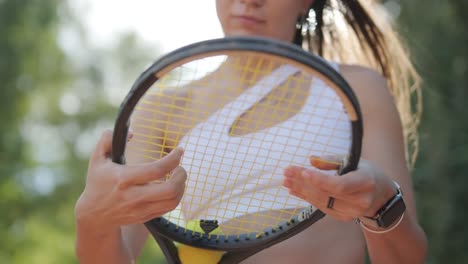 female tennis player practicing serve on outdoor court