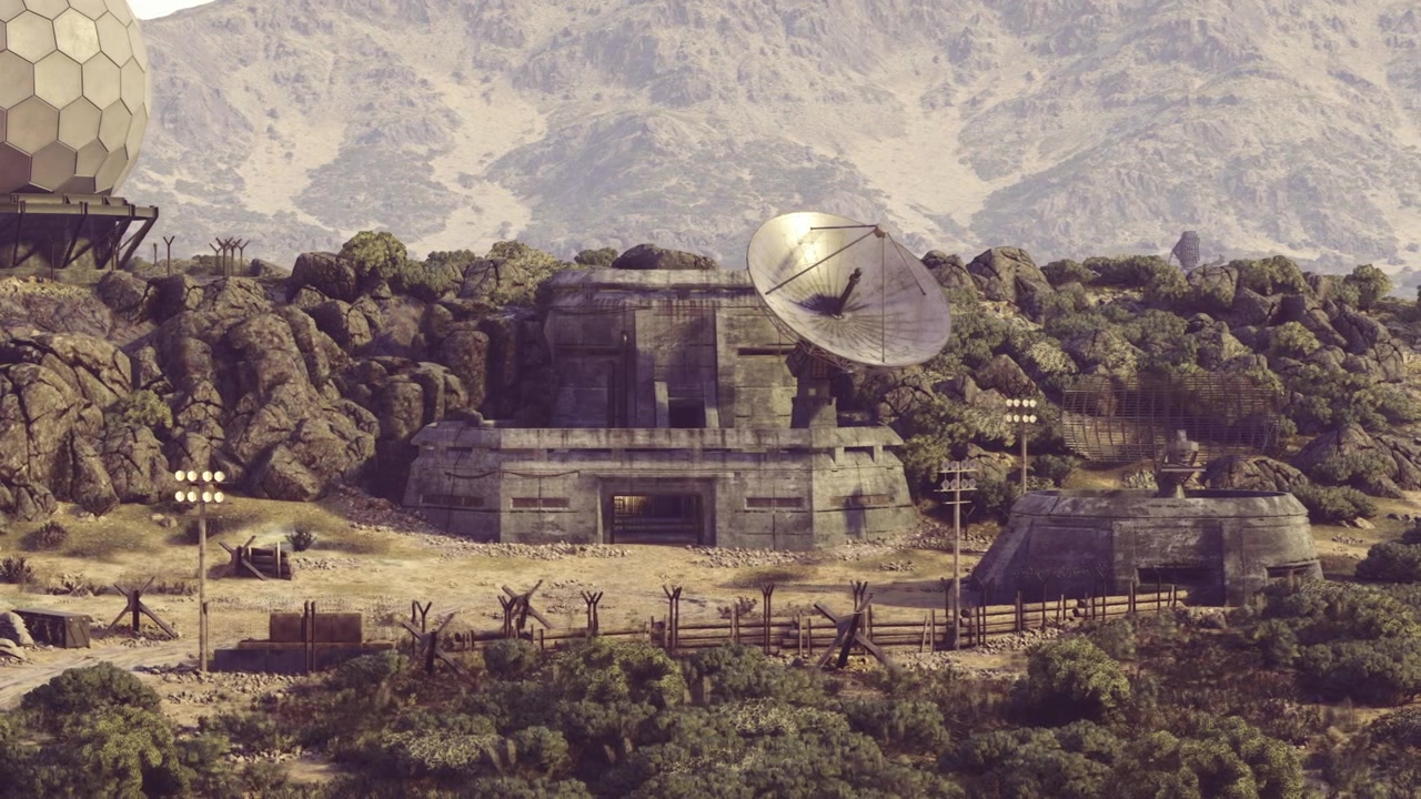 Deserted broadcast structures surrounded by overgrowth and weathered supports