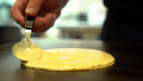 delicious golden pancake preparation: flipping and cooking to perfection on a hot griddle and enjoying the simple joys of breakfast