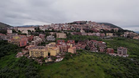 Tivoli-aerial-Italian-colourful-Village-set-on-the-side-of-a-hill,-Italy