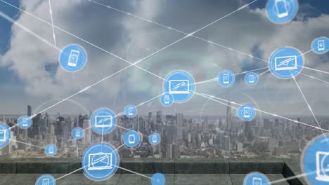 animation of network of digital icons against aerial view of cityscape