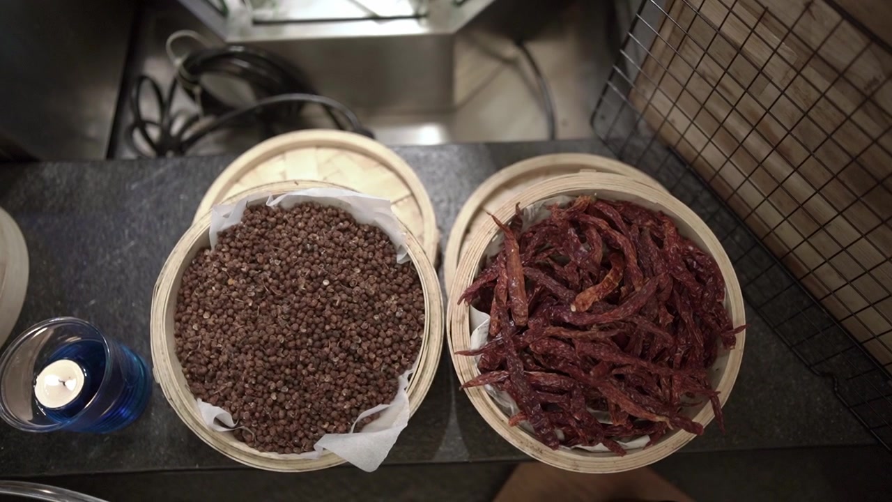 Close up of premium spices or ingredients inside dark culinary dishes