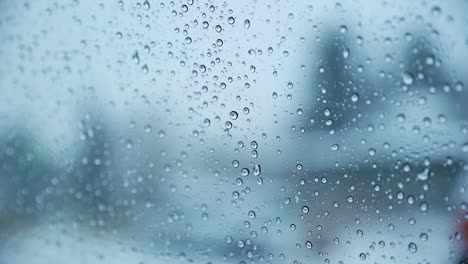 closeup view of melting snowflakes on windshield