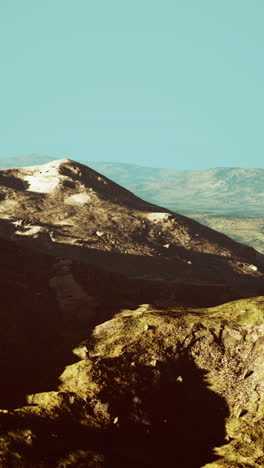 a mountain range in a clear blue sky