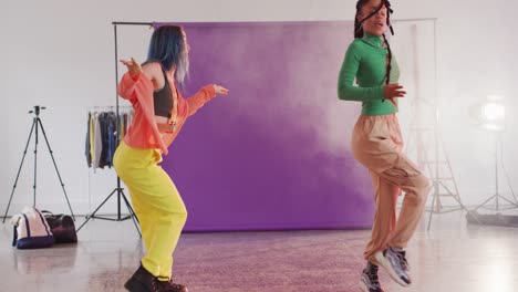 Happy-diverse-female-dancers-dancing-together-in-dance-studio,-slow-motion