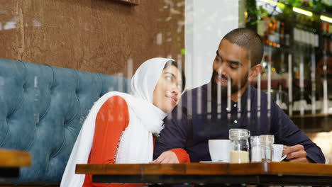 couple interacting with each other in cafeteria 4k