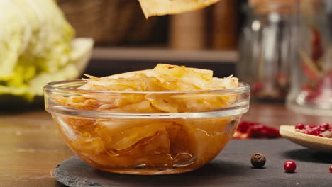 A bowl of comfort food served with chopsticks on a table. The dish contains a delicious recipe with fresh ingredients, perfect for enjoying as a quick meal or dessert