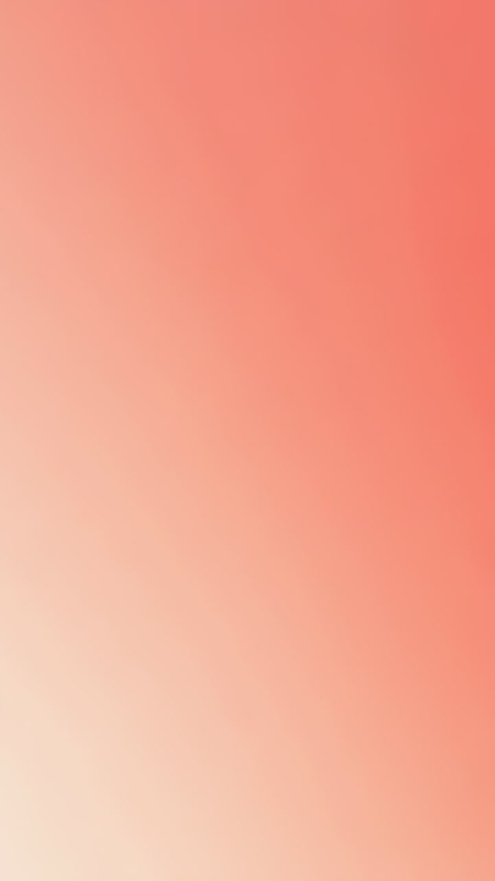 Vertical video: Shifting peach coral field deepening to warmer coral as frames advancing in frame