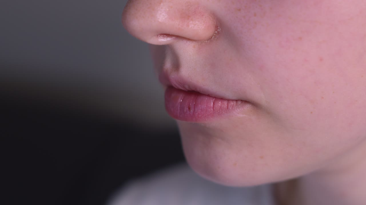 Close-up of a Young Person Drinking Water