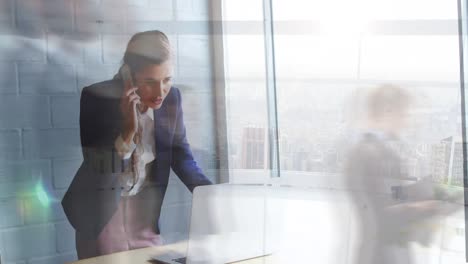 Animation-of-caucasian-businesswoman-talking-on-cellphone-over-time-lapse-of-blurred-people