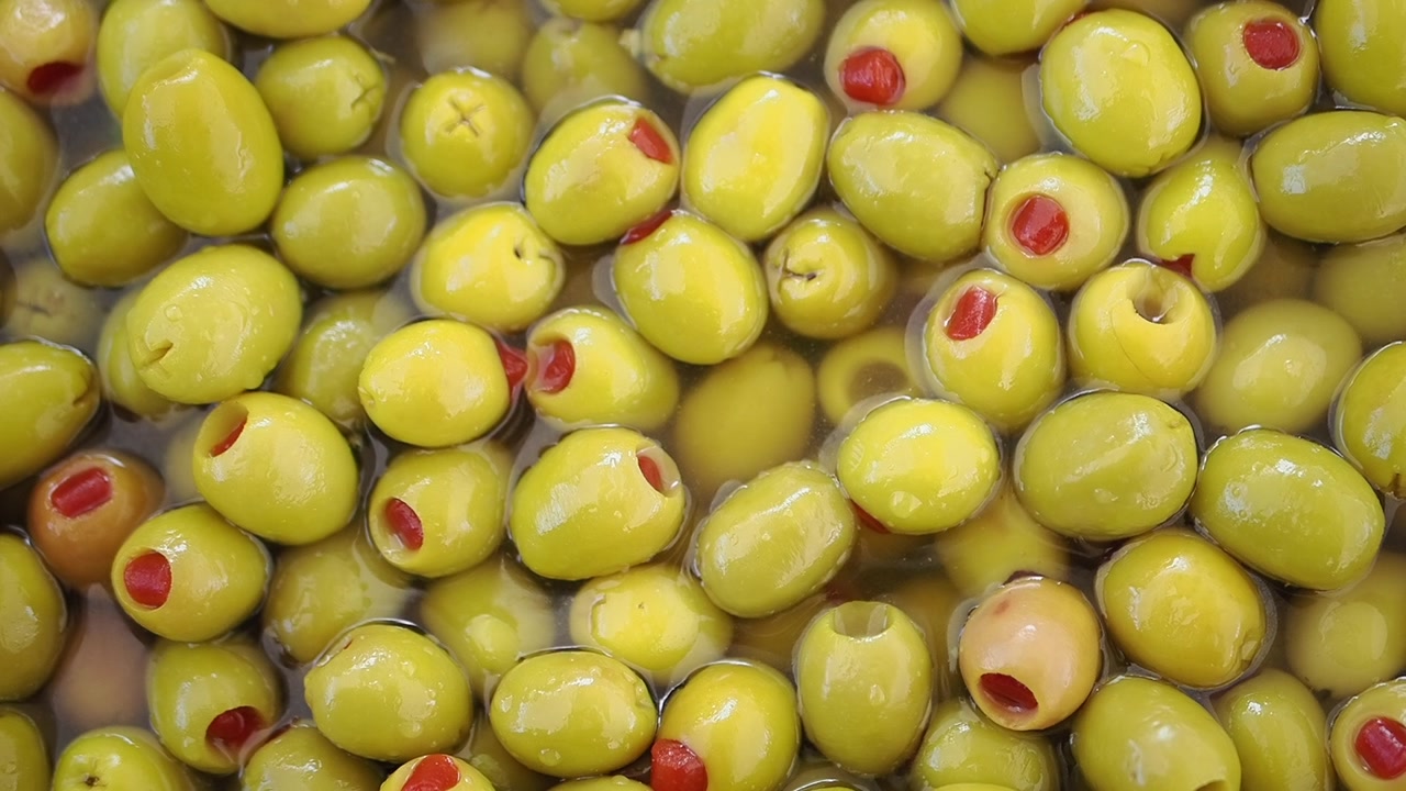 Close-Up of Green Olives Stuffed with Pimento in Brine