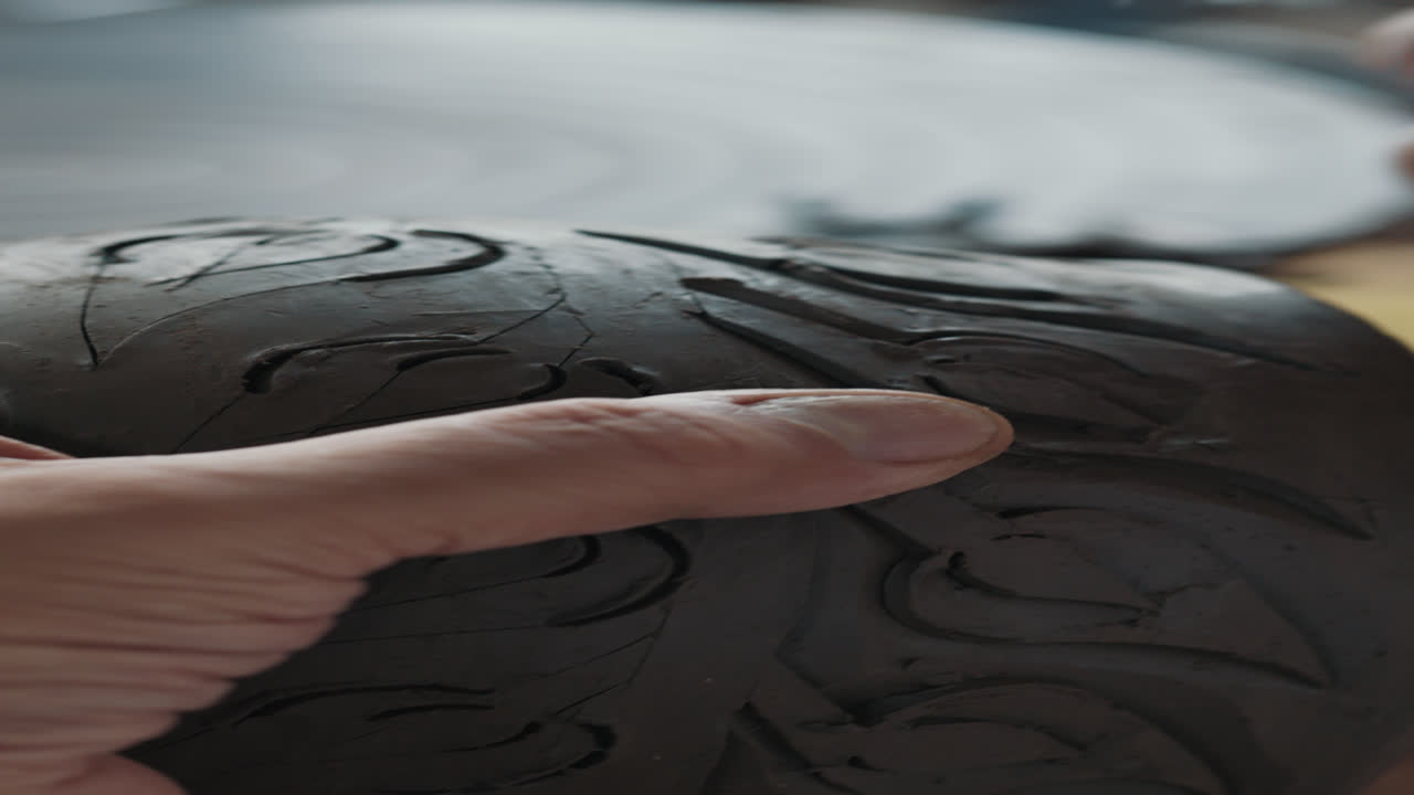Close up of a clay pot being crafted
