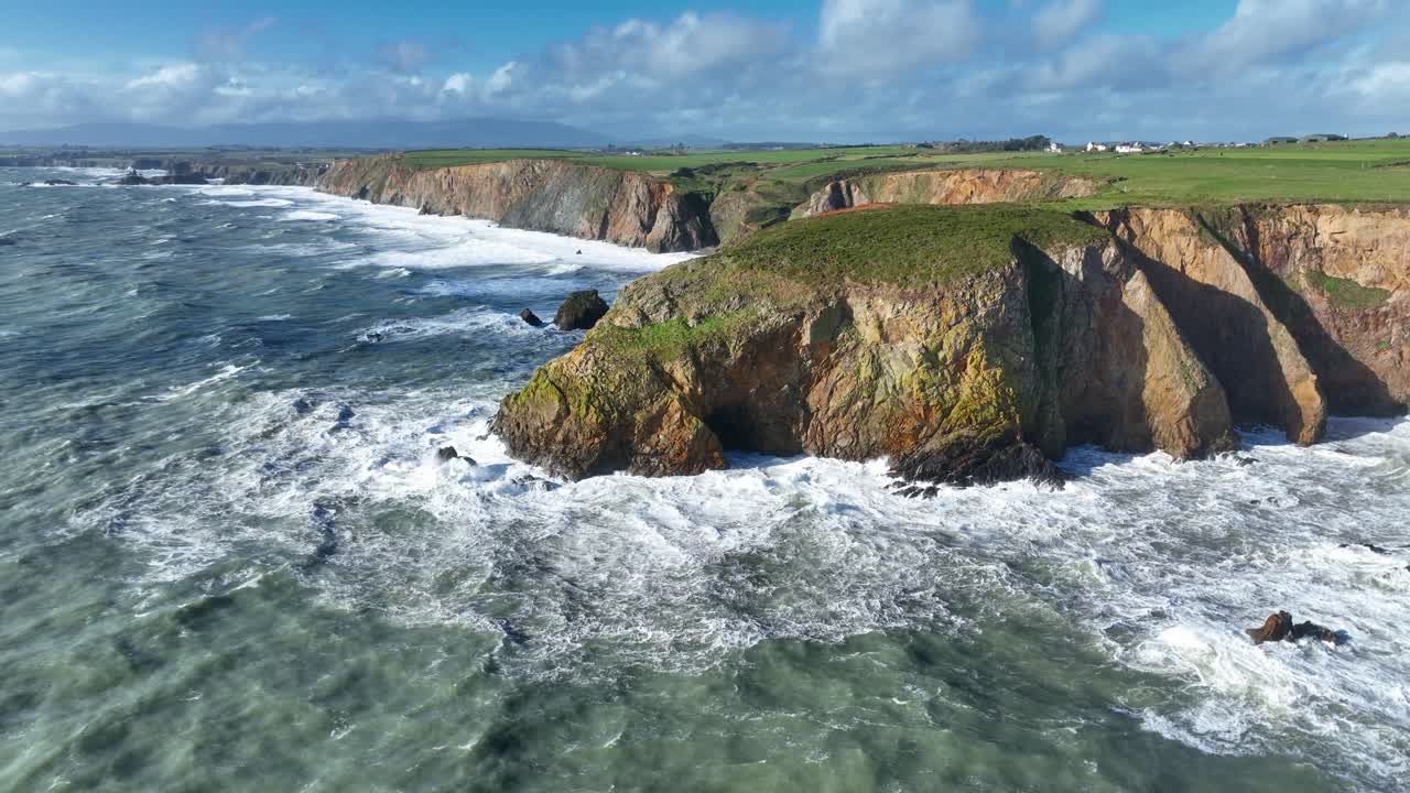 Epic Ireland dramatic drone view of winter storm on the Copper Coast Waterford high seas batter fragile sea cliffs causing coastal erosion