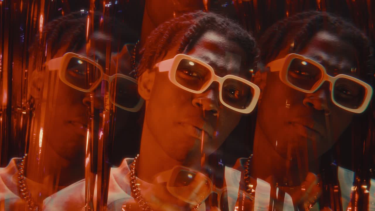 Kaleidoscopic Effect of Black Rapper Performing Hip-Hop in Nightclub