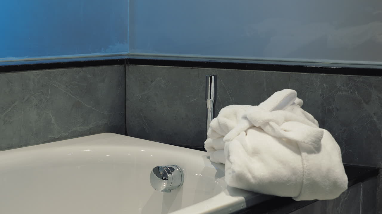 Placing bathrobe in the bathroom