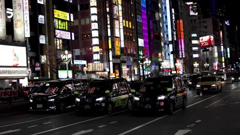 time-lapse of vibrant city street at night