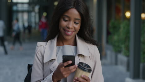 portrait young african american business woman using smartphone enjoying relaxing on lunch break texting browsing messages reading emails in city slow motion
