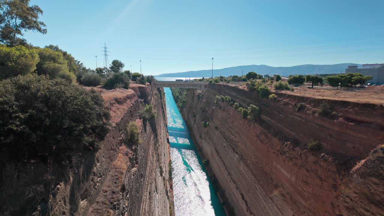 Pan down views Corinth canal link to Saronic Gulf Aegean Sea.