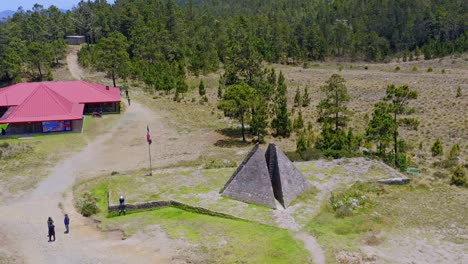 Aerial-orbit-shot-of-tourist-visiting-Pyramids-of-Valle-Nuevo-in-scenic-area-of-Dominican-Republic