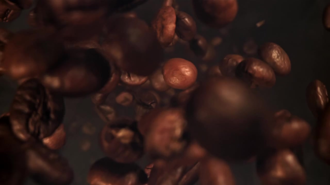 Chicchi di caffè tostati che cadono e vorticano al rallentatore