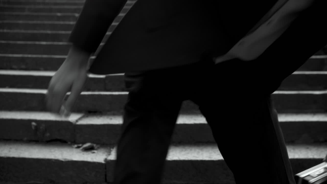 Man in Skull Mask Sitting on Stairs