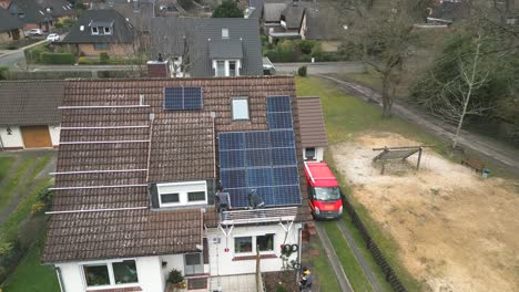 workers are installing a solar panel system on the roof of a single-family home. solar energy - eco-friendly power source