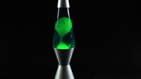 green lava lamp with moving wax blobs