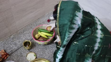 indian-women-doing-holy-rituals-at-home-for-children's-wellbeing-from-different-angle-on-the-occasion-of-jitiya-vrat-or-nirjala-vrat-in-india