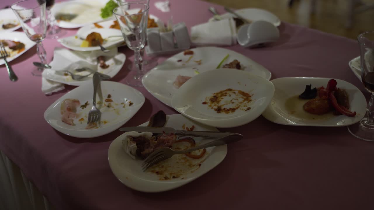 Leftover food after party, dirty food. After banquet is finished. Concept of the restaurant business.