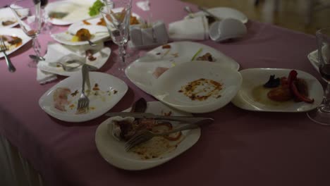 leftover food after party, dirty food. after banquet is finished. concept of the restaurant business.